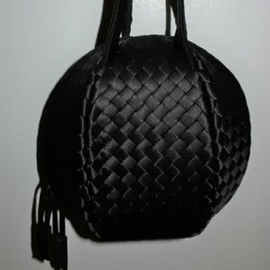 Bottega Veneta 90s rate silk woven round black evening bag.